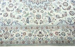 Corner detail of New Nain rug showing border pattern and Wool pile