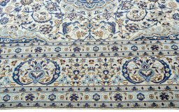 Corner detail of 2000s Nain rug showing border pattern and Wool pile