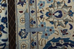 Backside of handmade 2000s Nain rug showing knot structure and weave density