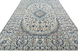 Surface texture of 2000s Nain rug with natural Wool and intricate pattern