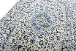 Backside of handmade 2000s Nain rug showing knot structure and weave density