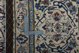 Backside of handmade New Nain rug showing knot structure and weave density