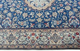 Corner detail of 2000s Nain rug showing border pattern and Wool pile