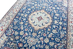 Backside of handmade 2000s Nain rug showing knot structure and weave density