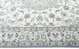 Corner detail of 2000s Nain rug showing border pattern and Wool pile