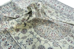 Surface texture of 2000s Nain rug with natural Wool and intricate pattern