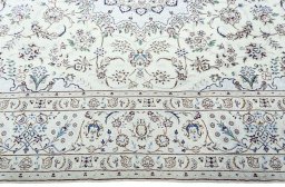 Corner detail of 2000s Nain rug showing border pattern and Wool pile