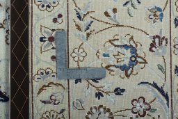 Backside of handmade 2000s Nain rug showing knot structure and weave density