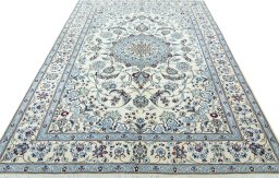 Surface texture of 2000s Nain rug with natural Wool and intricate pattern