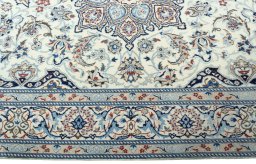 Corner detail of New Nain rug showing border pattern and Wool pile