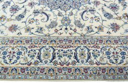 Corner detail of 2000s Nain rug showing border pattern and Wool pile