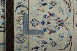 Backside of handmade New Nain rug showing knot structure and weave density