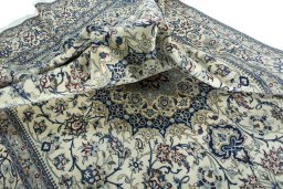 Surface texture of 2000s Nain rug with natural Wool and intricate pattern