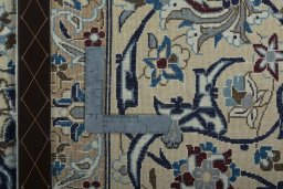 Backside of handmade 2000s Nain rug showing knot structure and weave density