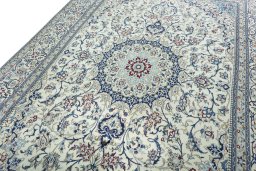 Backside of handmade 2000s Nain rug showing knot structure and weave density