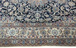 Corner detail of 2000s Nain rug showing border pattern and Wool pile