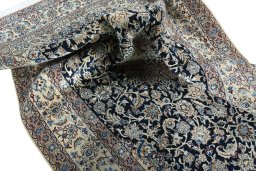 Surface texture of 2000s Nain rug with natural Wool and intricate pattern