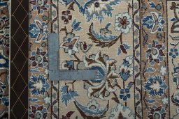 Backside of handmade 2000s Nain rug showing knot structure and weave density
