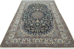 Surface texture of 2000s Nain rug with natural Wool and intricate pattern