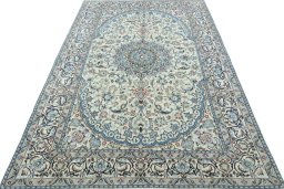 Surface texture of Unknown Nain rug with natural Wool and intricate pattern