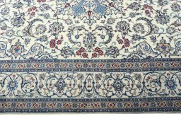 Corner detail of 2000s Nain rug showing border pattern and Cork pile