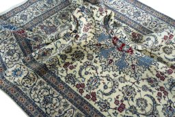 Surface texture of 2000s Nain rug with natural Cork and intricate pattern