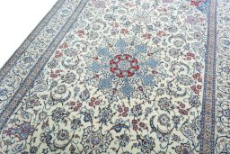 Backside of handmade 2000s Nain rug showing knot structure and weave density