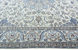Corner detail of 2000s Nain rug showing border pattern and Wool pile
