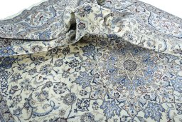 Surface texture of 2000s Nain rug with natural Wool and intricate pattern