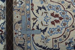 Backside of handmade 2000s Nain rug showing knot structure and weave density