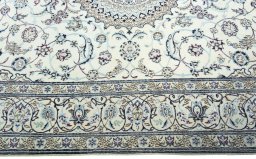 Corner detail of 2000s Nain rug showing border pattern and Wool pile
