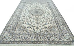 Surface texture of 2000s Nain rug with natural Wool and intricate pattern
