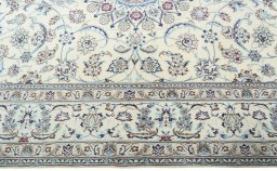 Corner detail of New Nain rug showing border pattern and Wool pile