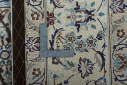 Backside of handmade New Nain rug showing knot structure and weave density