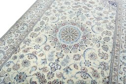 Backside of handmade New Nain rug showing knot structure and weave density