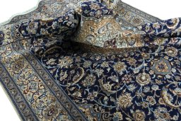 Surface texture of Unknown Nain rug with natural Wool and intricate pattern