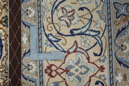 Backside of handmade Unknown Nain rug showing knot structure and weave density