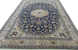 Surface texture of Unknown Nain rug with natural Wool and intricate pattern