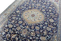 Backside of handmade Unknown Nain rug showing knot structure and weave density