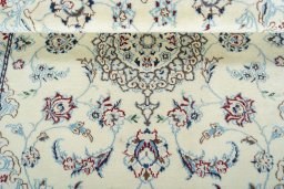 Corner detail of 2000s Nain rug showing border pattern and Wool pile