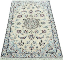 Surface texture of 2000s Nain rug with natural Wool and intricate pattern