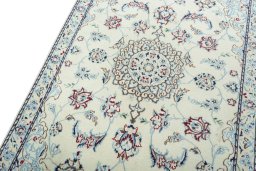 Backside of handmade 2000s Nain rug showing knot structure and weave density
