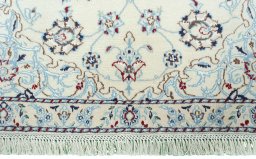 Close-up detail of 2000s Nain rug from Iran / Persia showing Wool weave