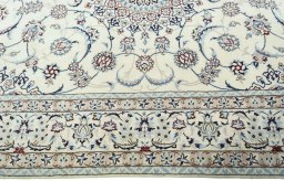 Corner detail of New Nain rug showing border pattern and Wool pile