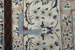 Backside of handmade New Nain rug showing knot structure and weave density