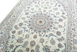 Backside of handmade New Nain rug showing knot structure and weave density