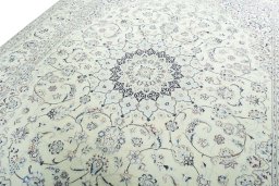 Backside of handmade New Nain rug showing knot structure and weave density