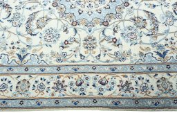 Corner detail of 2000s Nain rug showing border pattern and Wool pile
