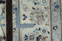 Backside of handmade 2000s Nain rug showing knot structure and weave density