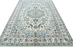 Surface texture of 2000s Nain rug with natural Wool and intricate pattern